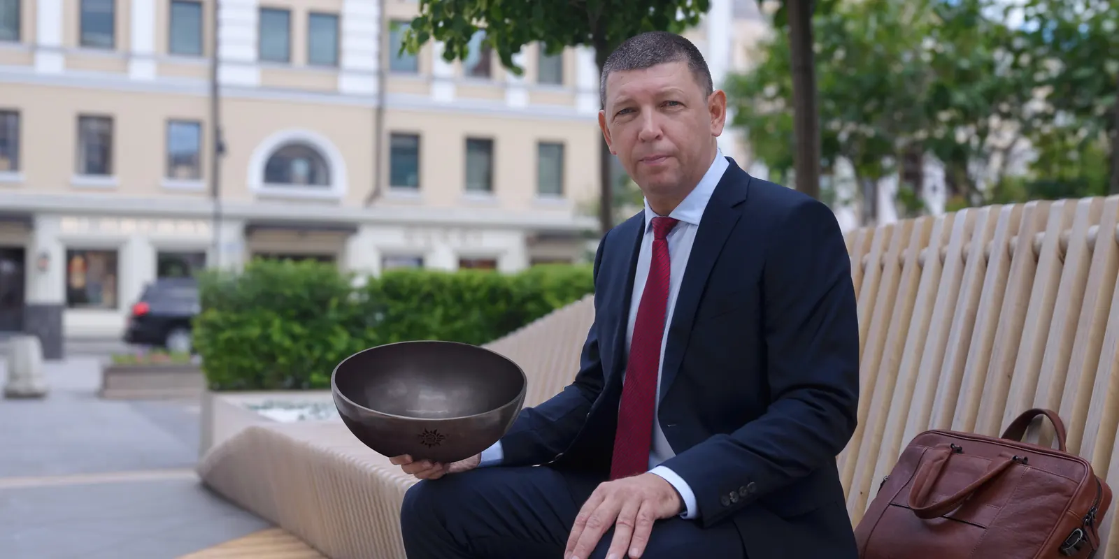 Dr. Viktor Surikov, founder of Healingbowl, with a singing bowl