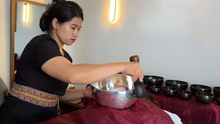 Contact sound therapy session with a Healingbowl singing bowl