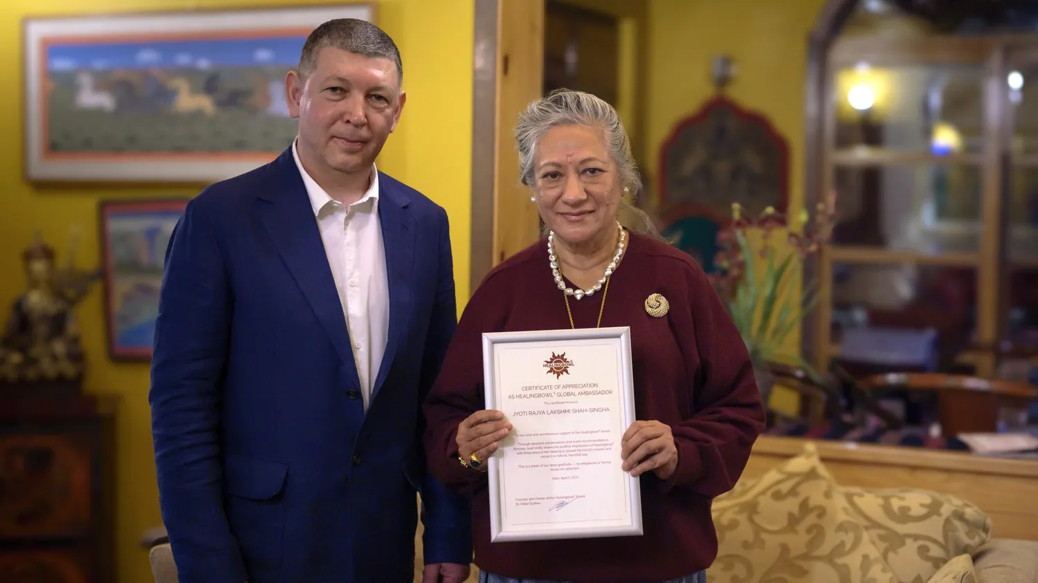 Dr. Viktor Surikov presenting the Global Ambassador certificate to Princess Jyoti Rajya Lakshmi Shah