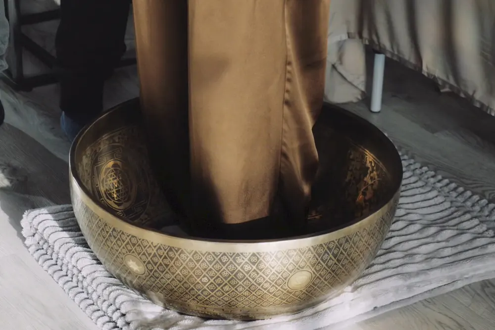 A guest standing in the giant bowl at the start of a session