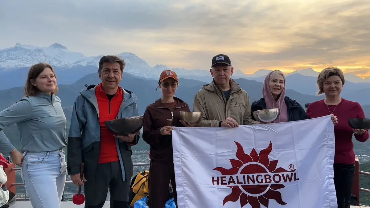 A Healingbowl course group with their bowls at sunrise in the Himalaya